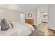 Spacious bedroom with ensuite bath, wood floors, and neutral color palette at 4360 Woodglen Ln, Charlotte, NC 28226