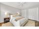 A bedroom with a ceiling fan, an area rug and double closets at 4360 Woodglen Ln, Charlotte, NC 28226