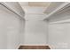 Spacious walk-in closet with ample storage shelves and racks for optimal organization at 4360 Woodglen Ln, Charlotte, NC 28226
