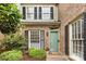Lovely front entrance with a green door, black shutters, and a welcoming entrance at 4360 Woodglen Ln, Charlotte, NC 28226