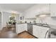 Well-lit kitchen featuring white cabinets, black countertops, and stainless steel appliances at 4360 Woodglen Ln, Charlotte, NC 28226