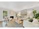 Spacious living room with a fireplace, neutral decor, and large windows at 4360 Woodglen Ln, Charlotte, NC 28226