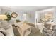 Living room showcases hardwood floors, neutral paint, and views of the dining area at 4360 Woodglen Ln, Charlotte, NC 28226
