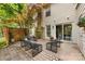 Back patio featuring a brick floor, sliding door, and outdoor seating area at 4360 Woodglen Ln, Charlotte, NC 28226