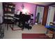 Music room with a grand piano, creating a unique and inspiring space with purple walls and bright light at 4671 Lucas Ct, Harrisburg, NC 28075