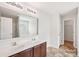 This spacious bathroom features a double sink vanity and a mirror above it at 5030 Ashley Place Dr, Bessemer City, NC 28016