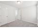 Neutral carpeted bedroom with closet and ensuite access at 5030 Ashley Place Dr, Bessemer City, NC 28016