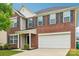 Traditional two-story brick home with a two-car garage and neatly landscaped front yard at 5030 Ashley Place Dr, Bessemer City, NC 28016