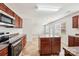 Modern kitchen featuring stainless steel appliances, an island, and hardwood floors at 5030 Ashley Place Dr, Bessemer City, NC 28016