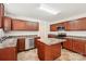 Well-equipped kitchen with central island, stainless steel appliances, and ample cabinetry at 5030 Ashley Place Dr, Bessemer City, NC 28016