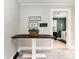 Charming dining area with decorative signs on the wall, next to the laundry room at 506 Englewood Ne St, Concord, NC 28025