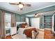 Spacious main bedroom with hardwood floors, ceiling fans and plenty of natural light at 506 Englewood Ne St, Concord, NC 28025