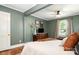 Comfortable main bedroom featuring a decorative dresser and bedside tables at 506 Englewood Ne St, Concord, NC 28025