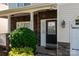 Inviting front entry featuring stone accents, a black front door, and manicured landscaping at 5106 Stone Park Dr, Charlotte, NC 28269