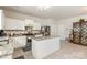 Open kitchen boasts granite countertops, stainless appliances, and white cabinets at 5106 Stone Park Dr, Charlotte, NC 28269