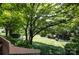 Lush backyard with mature trees, and well-maintained landscaping at 5128 Dunes Ct, Charlotte, NC 28226