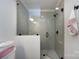 Modern walk-in shower featuring sleek hardware, and classic tile at 5128 Dunes Ct, Charlotte, NC 28226