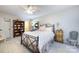 Comfortable bedroom with neutral walls, ceiling fan, and decorative furnishings at 5128 Dunes Ct, Charlotte, NC 28226
