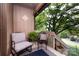 Outdoor deck with a peaceful setting, seating, and beautiful foliage at 5128 Dunes Ct, Charlotte, NC 28226