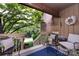 Cozy outdoor deck with comfortable seating and views of the surrounding landscaping at 5128 Dunes Ct, Charlotte, NC 28226