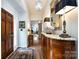 Elegant foyer featuring hardwood floors, a stylish console, and a view into the living area, creating a warm welcome at 5128 Dunes Ct, Charlotte, NC 28226