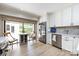 Bright kitchen features stainless steel appliances, white cabinets, and a breakfast area at 5128 Dunes Ct, Charlotte, NC 28226