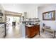 Stylish kitchenette featuring white cabinets, marble counters, and a view to the outside at 5128 Dunes Ct, Charlotte, NC 28226