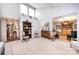 Sun-filled living room with hardwood and carpet flooring leading to other parts of the home at 5128 Dunes Ct, Charlotte, NC 28226
