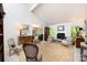 Elegant living room featuring a fireplace, neutral paint, and lots of natural light at 5128 Dunes Ct, Charlotte, NC 28226