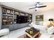 Spacious living room with neutral walls, built-in shelves, and recessed lighting at 5128 Dunes Ct, Charlotte, NC 28226