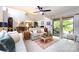 Comfortable living room with a ceiling fan, neutral paint, and access to an outdoor space at 5128 Dunes Ct, Charlotte, NC 28226