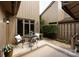 Charming outdoor patio furnished with a table and chairs, set on brick pavers for relaxed living at 5128 Dunes Ct, Charlotte, NC 28226