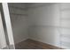 Spacious walk-in closet featuring wood floors, wire shelving, and ample storage space at 532 Robinhood Rd # 27, Maiden, NC 28650
