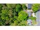 Aerial view of property showcasing mature trees, surrounding neighborhood, and landscaping at 536 Hartness Rd, Statesville, NC 28677
