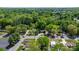 An aerial view of a neighborhood showcasing the layout of homes with mature trees offering shade at 536 Hartness Rd, Statesville, NC 28677