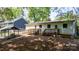 Fenced backyard with wooden deck and easy access ramp to home at 536 Hartness Rd, Statesville, NC 28677