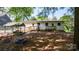 Spacious backyard featuring a wooden play structure and a ramp leading to the back of the house at 536 Hartness Rd, Statesville, NC 28677