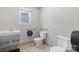 Accessible bathroom featuring toilet, sink, and safety bars at 536 Hartness Rd, Statesville, NC 28677