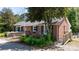 Brick ranch home with accessible ramp access and lush landscaping at 536 Hartness Rd, Statesville, NC 28677