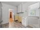 Kitchen featuring a sink, utility sink, and white cabinets at 536 Hartness Rd, Statesville, NC 28677