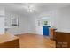 Living room featuring hardwood floors, utility sink and countertop, and an exterior door at 536 Hartness Rd, Statesville, NC 28677