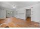 Spacious living room with hardwood floors, a ceiling fan, and traditional fireplace with built-ins at 536 Hartness Rd, Statesville, NC 28677