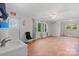 Bright living room with refinished wood floors, ample natural light, and a vintage utility sink at 536 Hartness Rd, Statesville, NC 28677