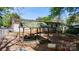 Outdoor play area featuring a covered wooden playhouse with built-in seating and ample toys for children at 536 Hartness Rd, Statesville, NC 28677