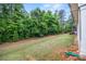 A view of the spacious backyard with lush greenery and manicured landscaping at 536 Rustlewood Way, Rock Hill, SC 29732