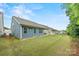 View of the home's exterior from the backyard, highlighting the siding and landscaping at 536 Rustlewood Way, Rock Hill, SC 29732