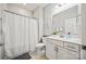 Clean bathroom featuring a shower with a curtain, a white vanity, and neutral tile flooring at 536 Rustlewood Way, Rock Hill, SC 29732