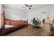 Comfortable bedroom with luxury vinyl plank floors, ceiling fan and neutral walls at 536 Rustlewood Way, Rock Hill, SC 29732