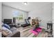 Bright flex room with workout equipment, a gray couch, and natural light at 536 Rustlewood Way, Rock Hill, SC 29732