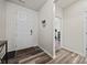 Bright foyer with wood-look floors, white door, and views to other rooms at 536 Rustlewood Way, Rock Hill, SC 29732